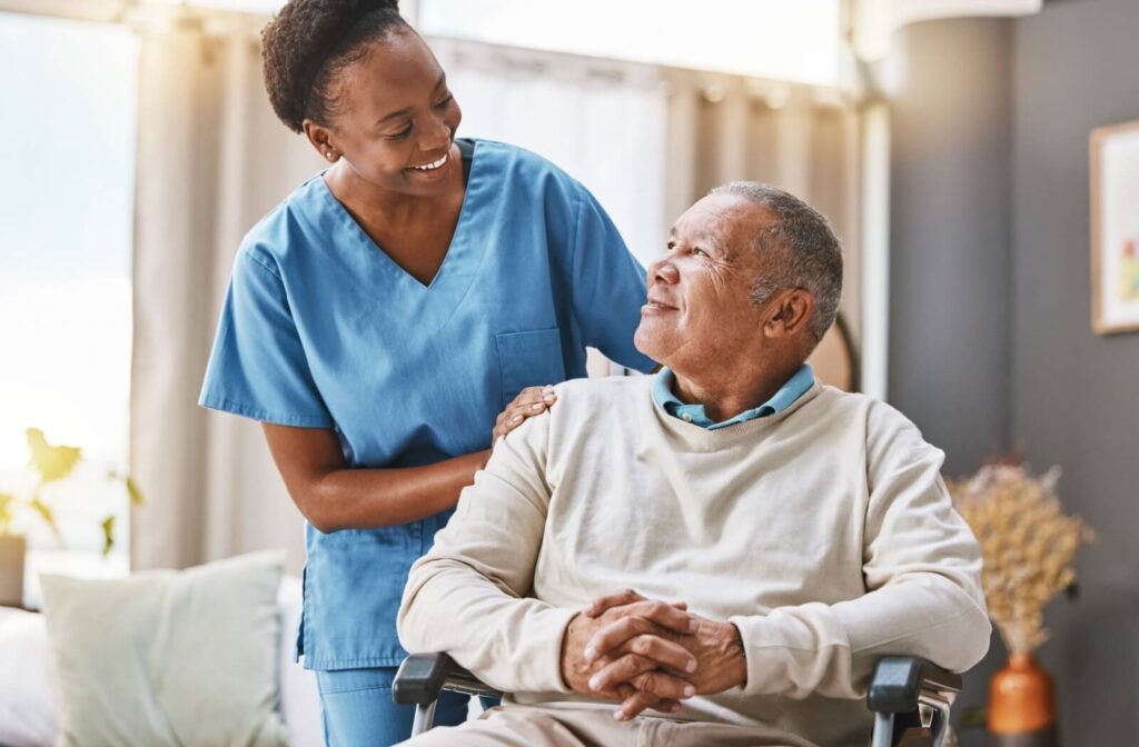 A nurse comforting an older adult in respite care.